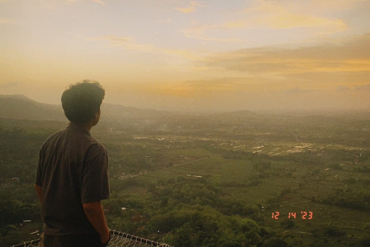 Dhanes overlooking a misty valley at golden hour