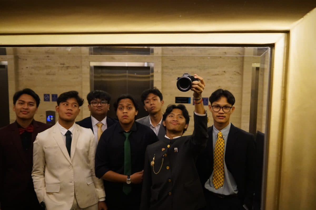 Friends in suits at a formal event